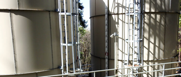 2 large water tanks with ladder